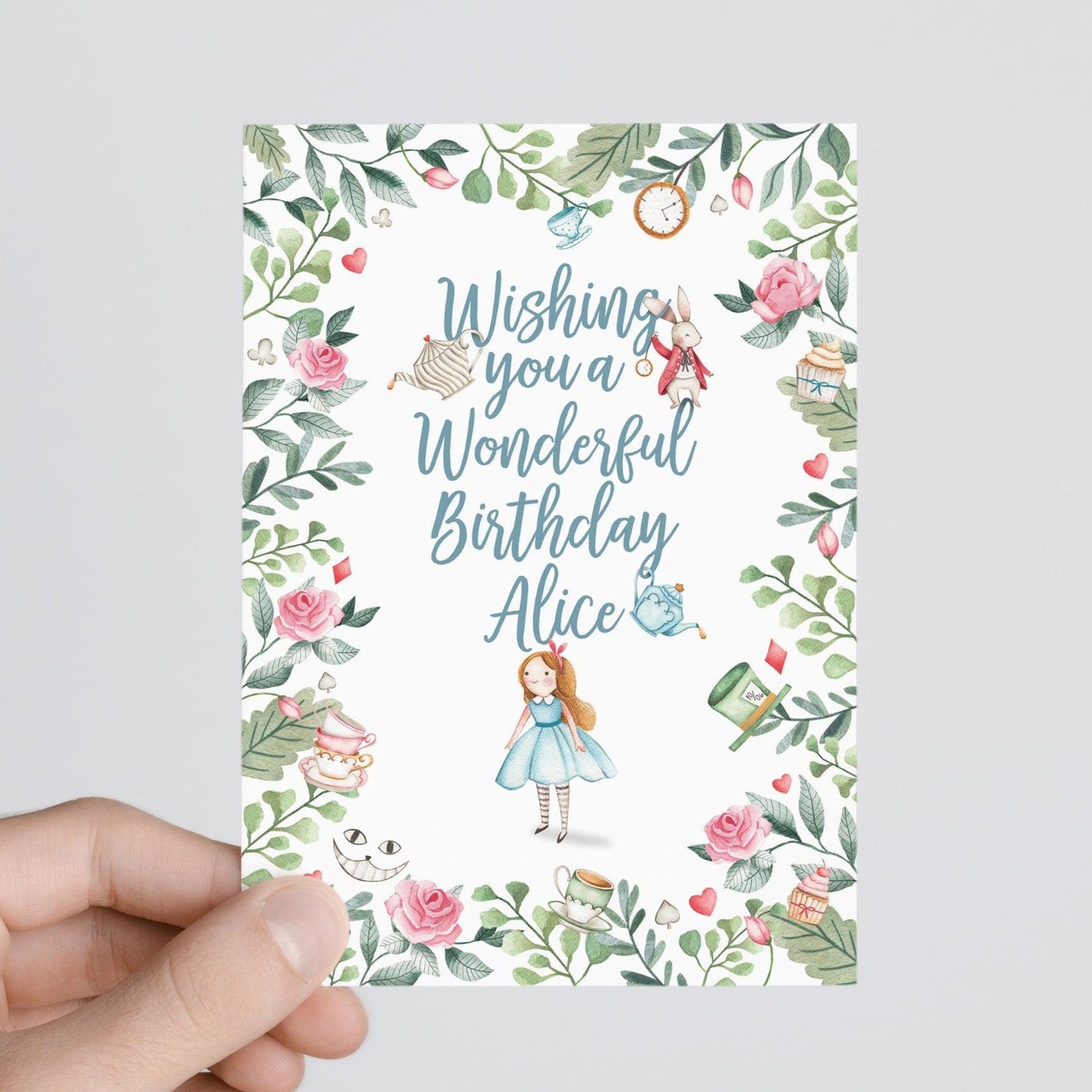 person holding Alice in wonderland personalised birthday card