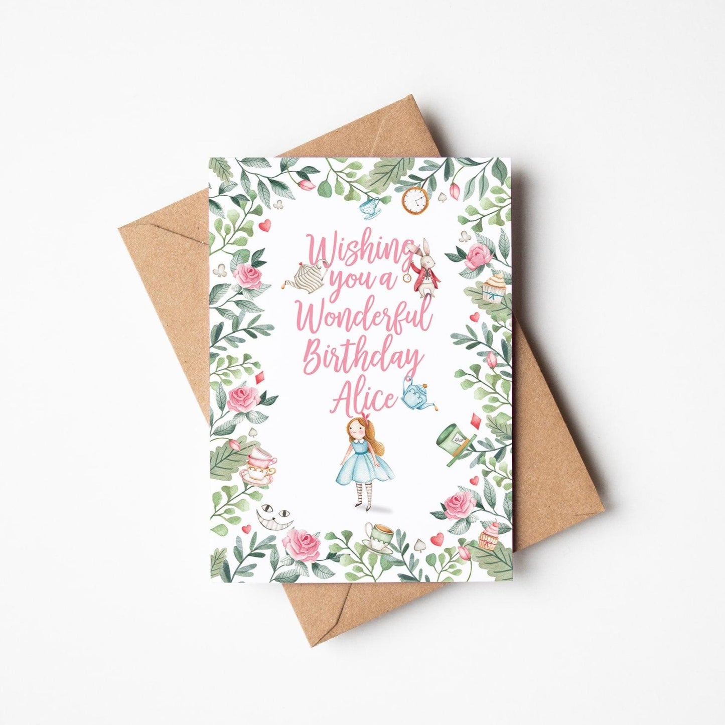 Alice in wonderland personalised birthday card with pink text and kraft envelope
