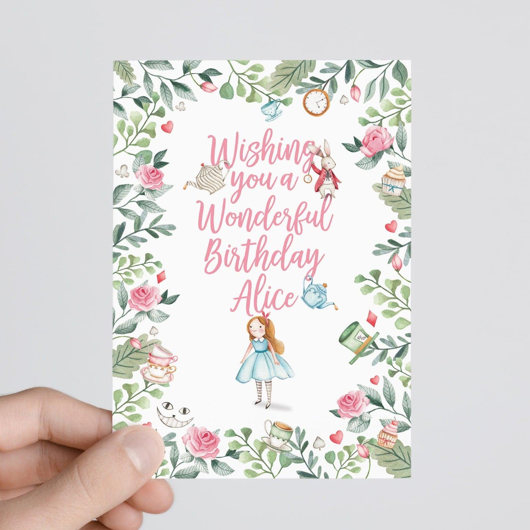 person holding Alice in wonderland personalised birthday card