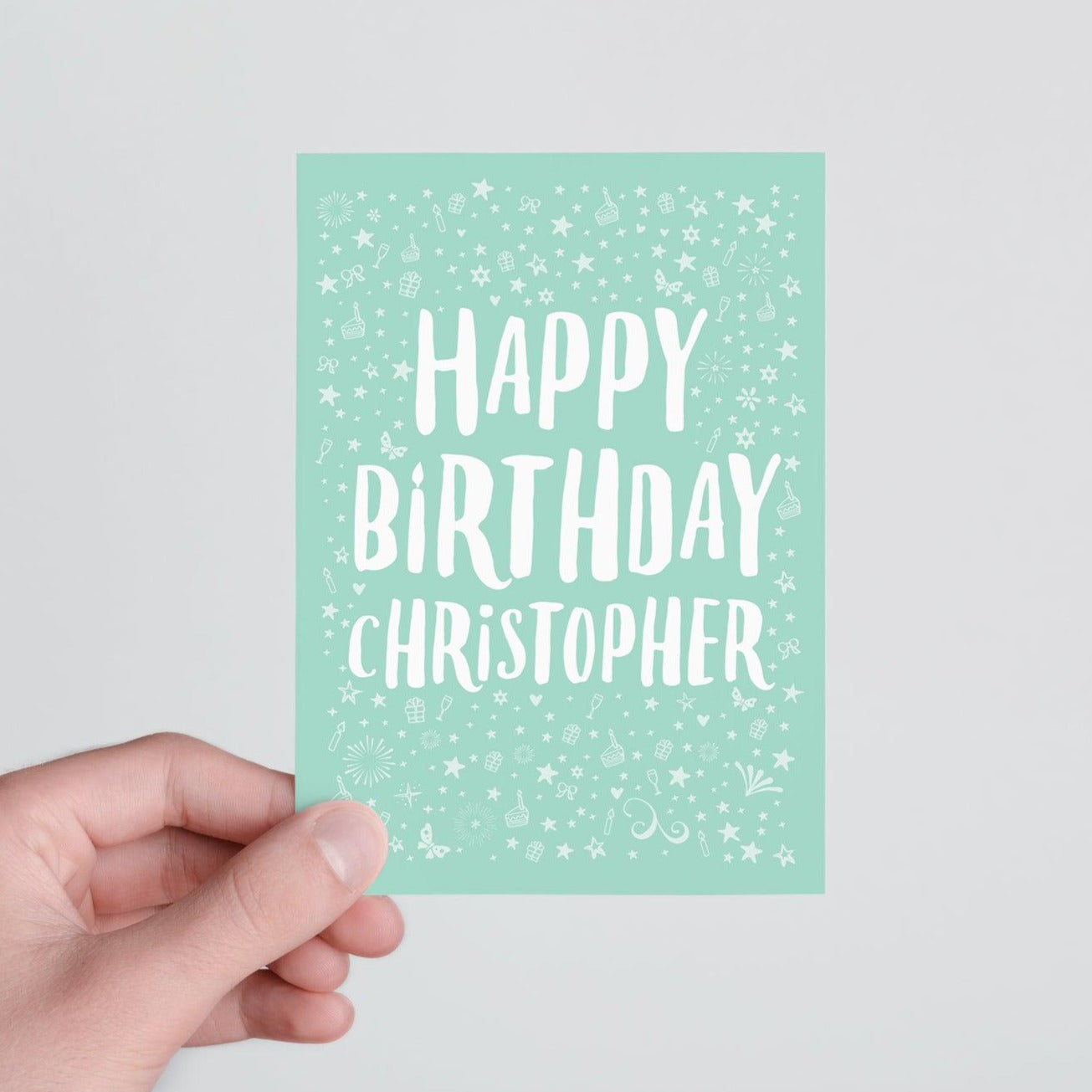 Person holding personalised Happy Birthday Card in teal